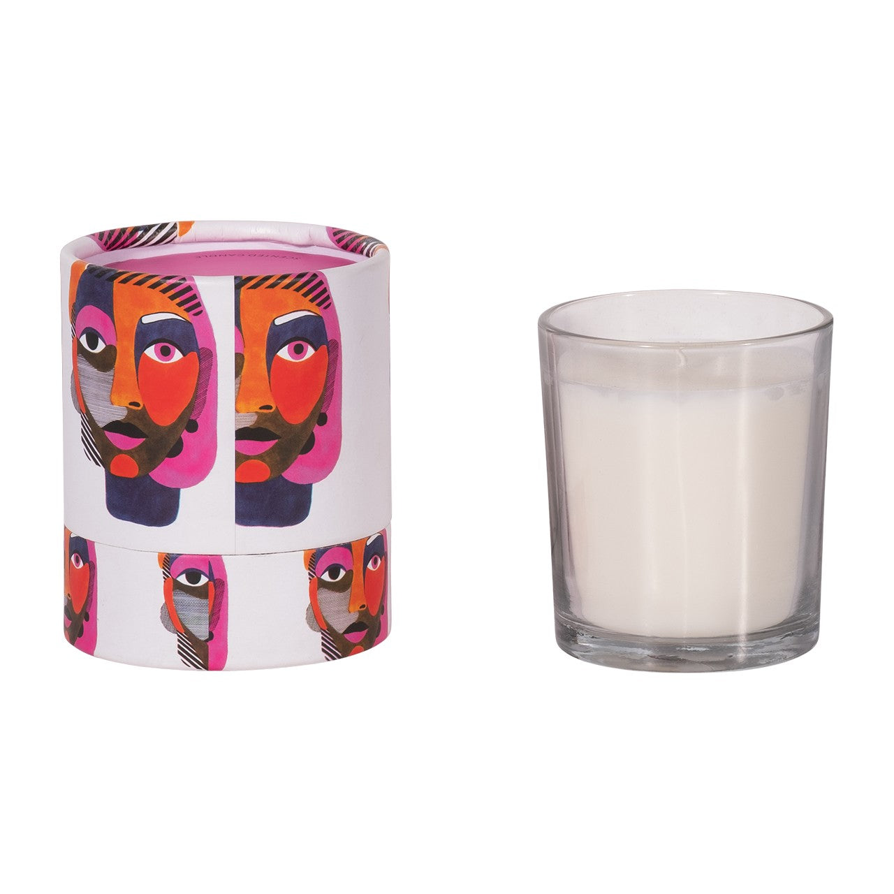 A colorful, abstract-printed box beside a plain white candle in a glass holder.