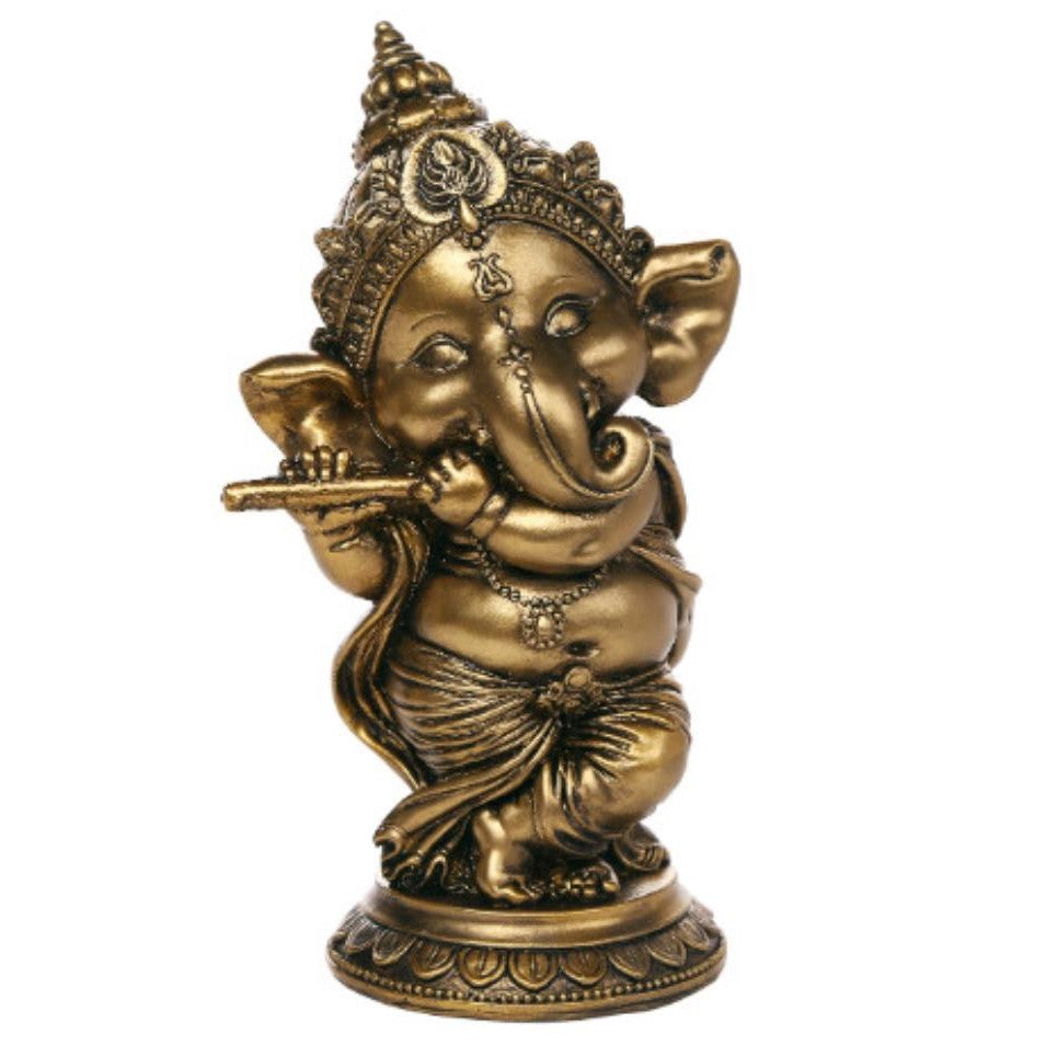 Golden statue of Ganesha playing a flute.