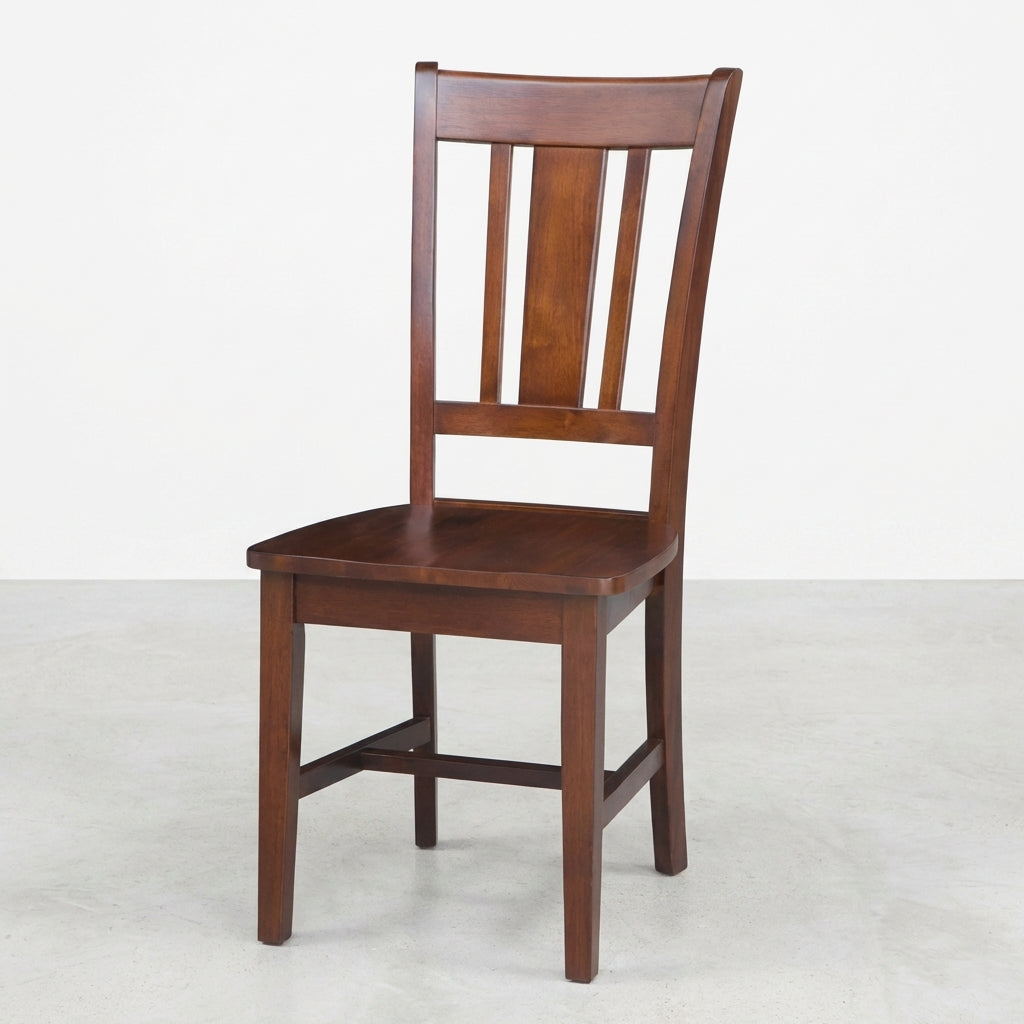 A wooden chair with a slatted backrest on a plain background.