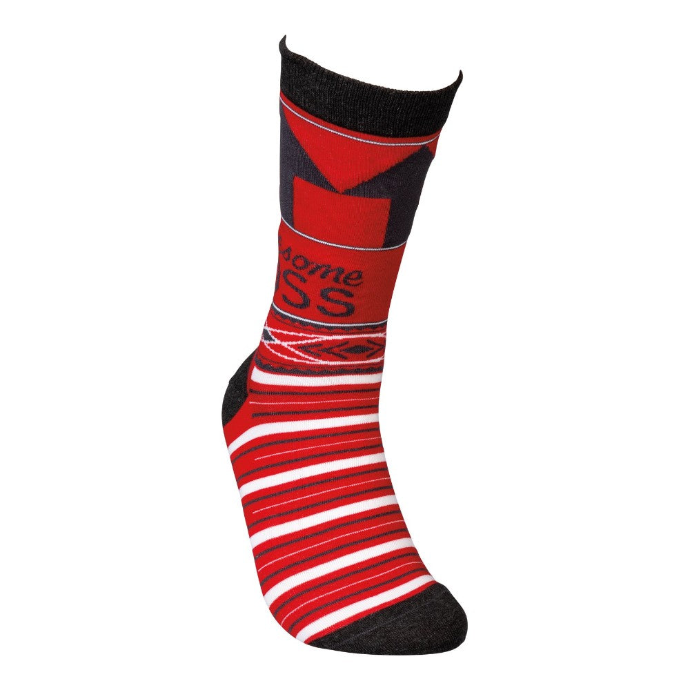 Colorful sock with red, black, and white patterns and designs.
