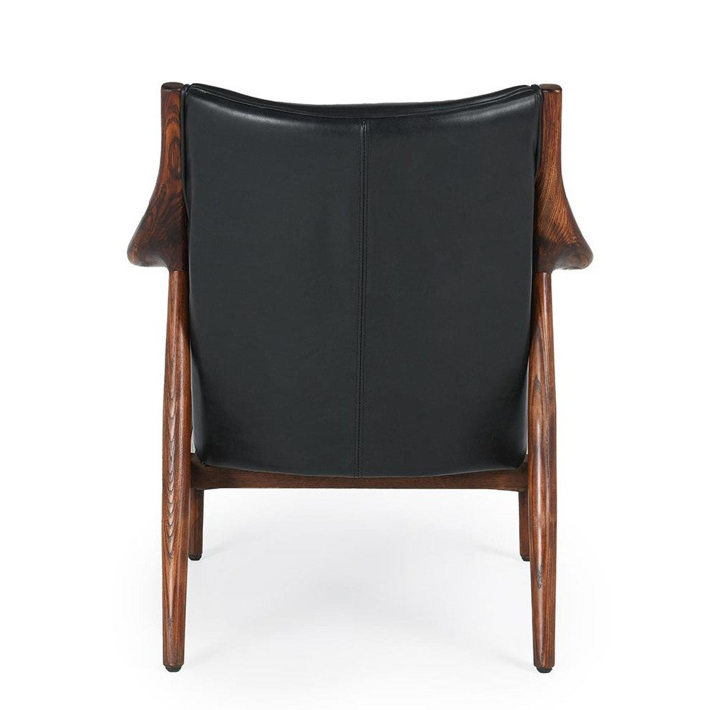 Wooden chair with dark leather backrest, rear view.