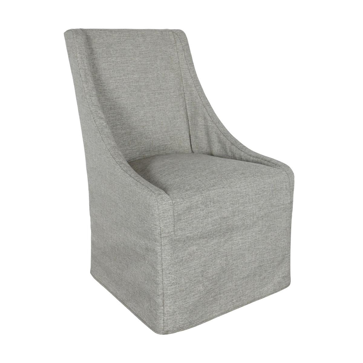 Grey upholstered chair with a high back and skirted base.