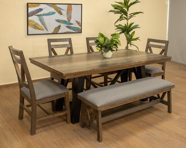 Wooden dining set with chairs, bench, plant, and feather art.