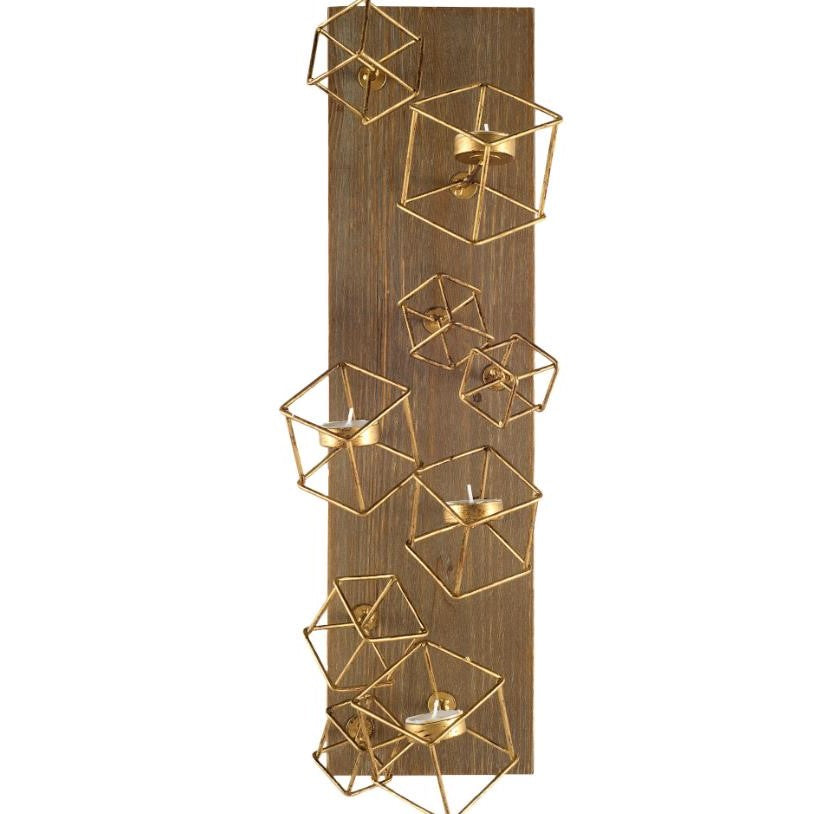 Gold cube candle holders on a vertical wood panel.