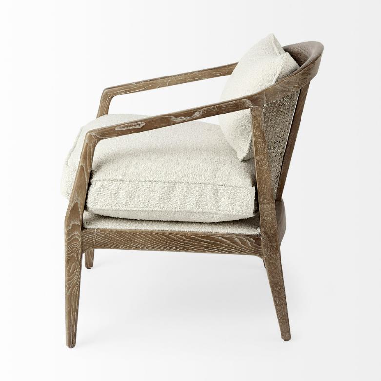 Modern wooden chair with plush white cushions.