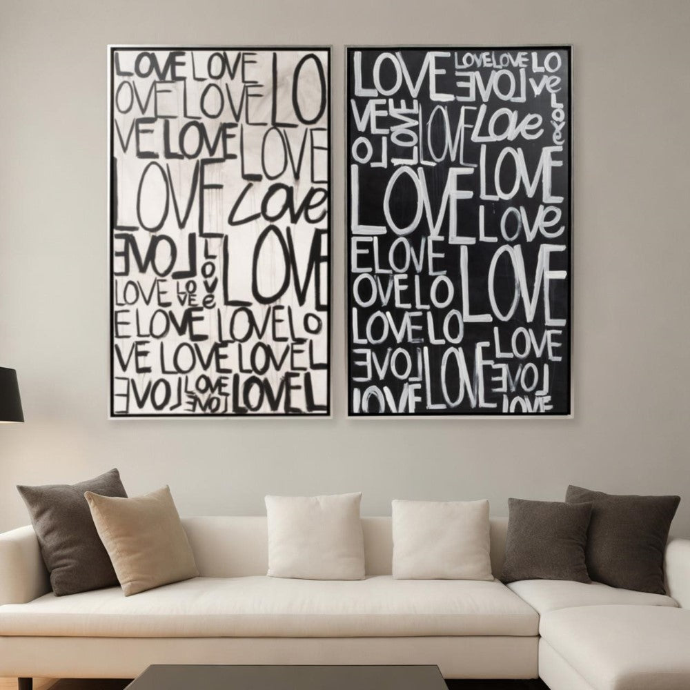 Two "LOVE" themed artworks over a modern sofa.