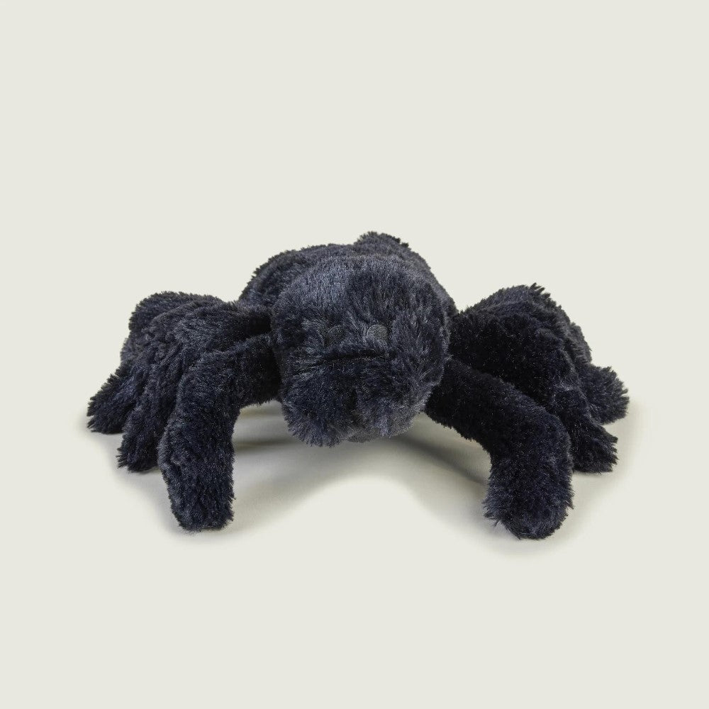 Plush black spider toy on a plain background.