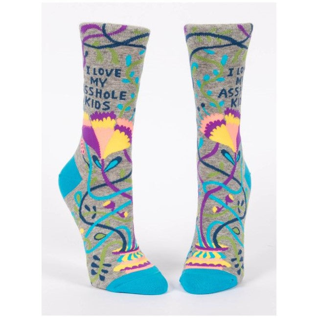 Colorful socks with humorous text and floral design.
