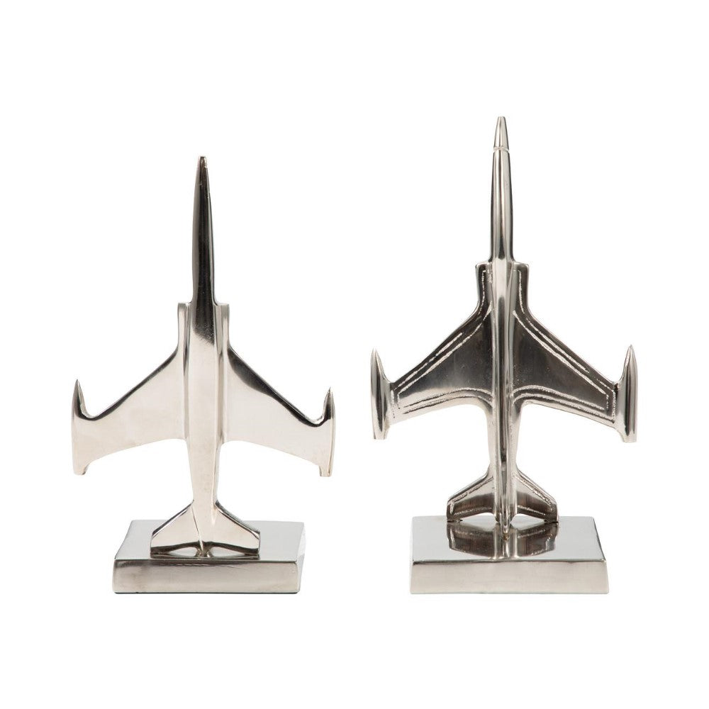 Two metallic airplane bookends on square bases.