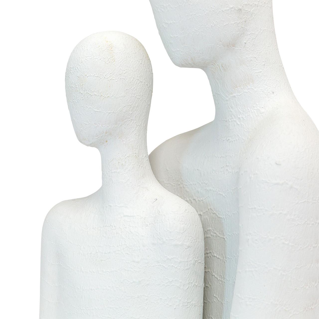 Two abstract white sculptures with textured surfaces.
