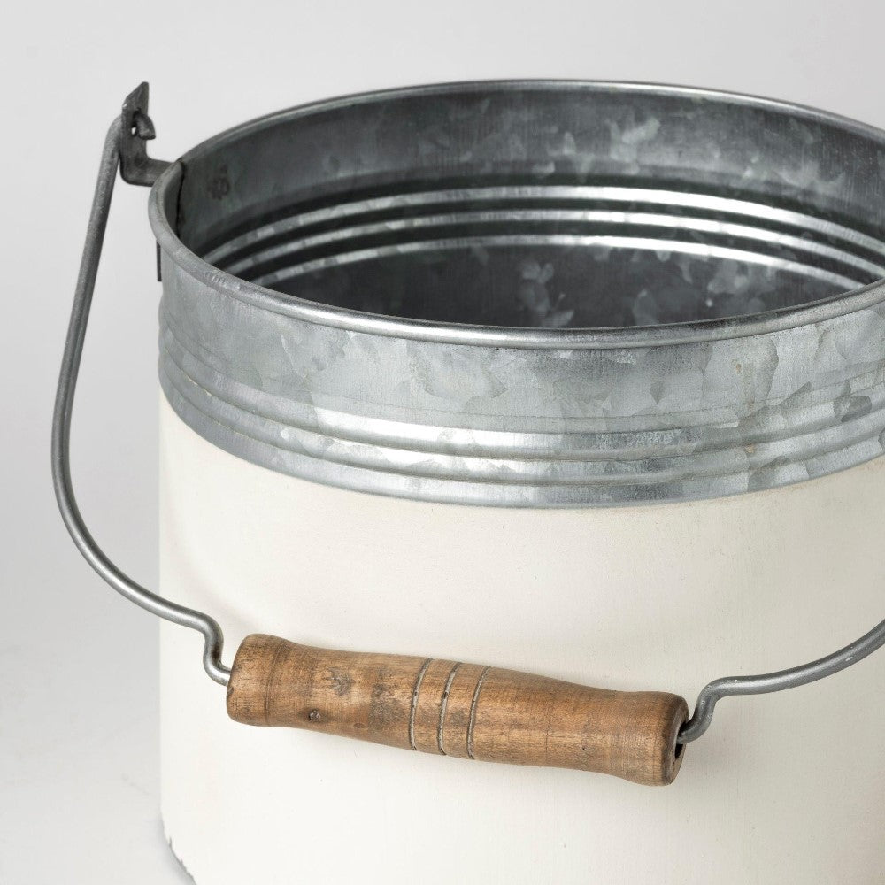 Metal bucket with a wooden handle, open top view.