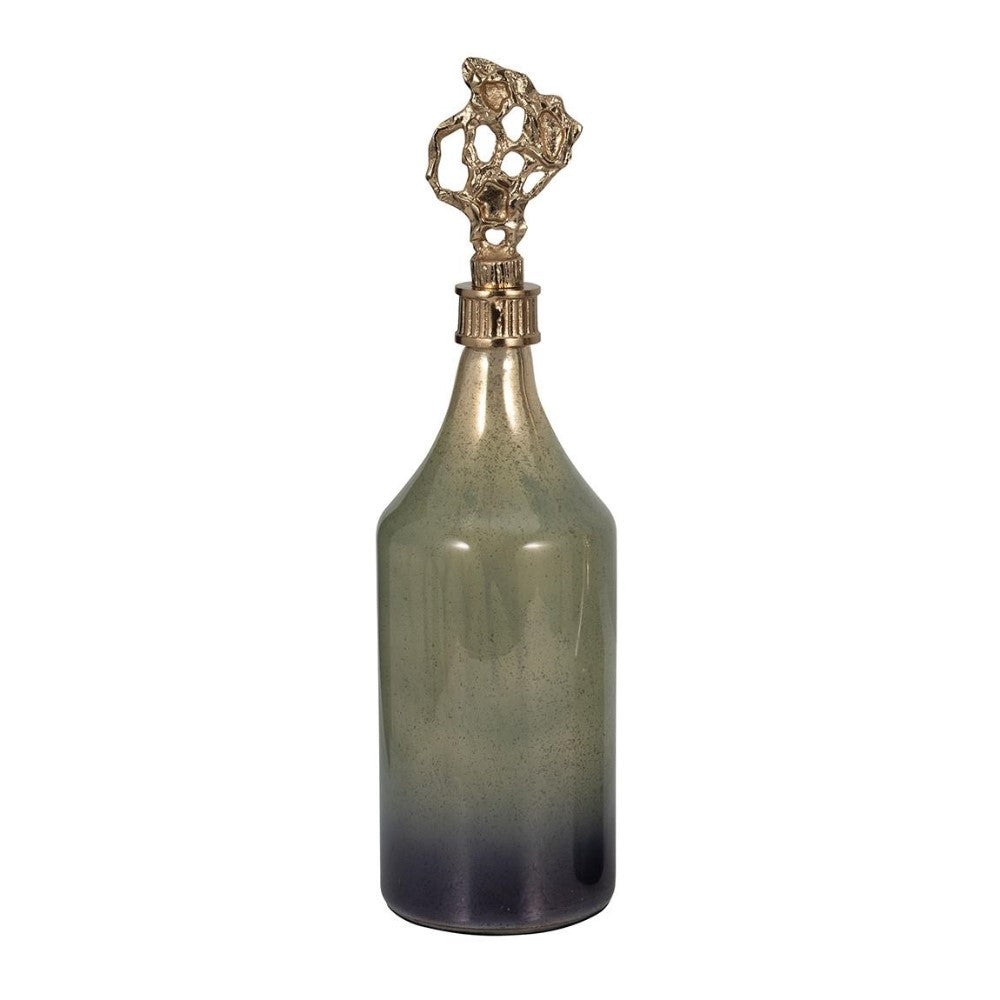 Glass bottle with ornate gold stopper.