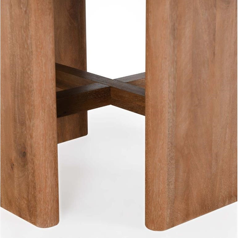 Wooden table legs with a cross support structure.
