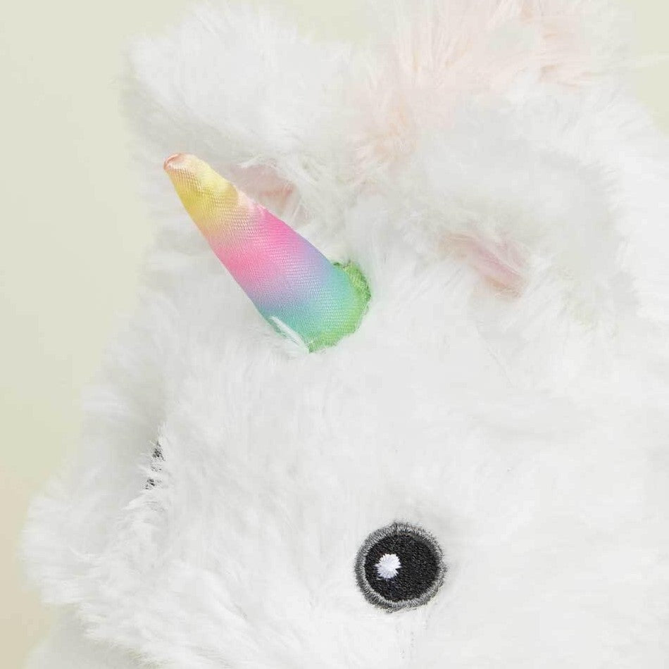 Fluffy white unicorn plush with a rainbow horn.