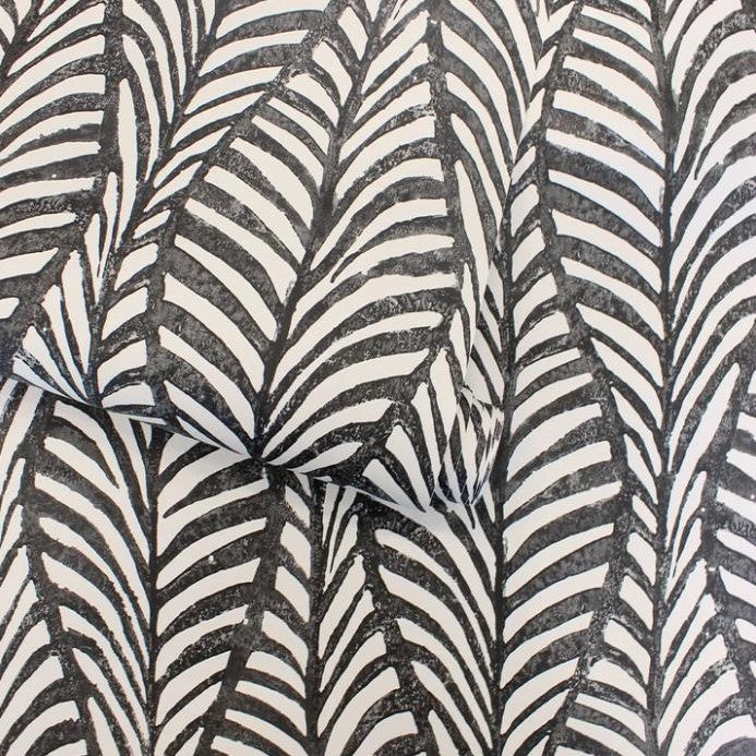 Black and white leaf-patterned fabric.