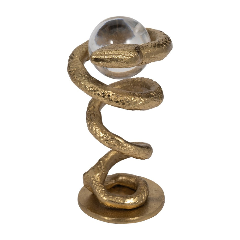 Golden snake sculpture holding a glass orb.