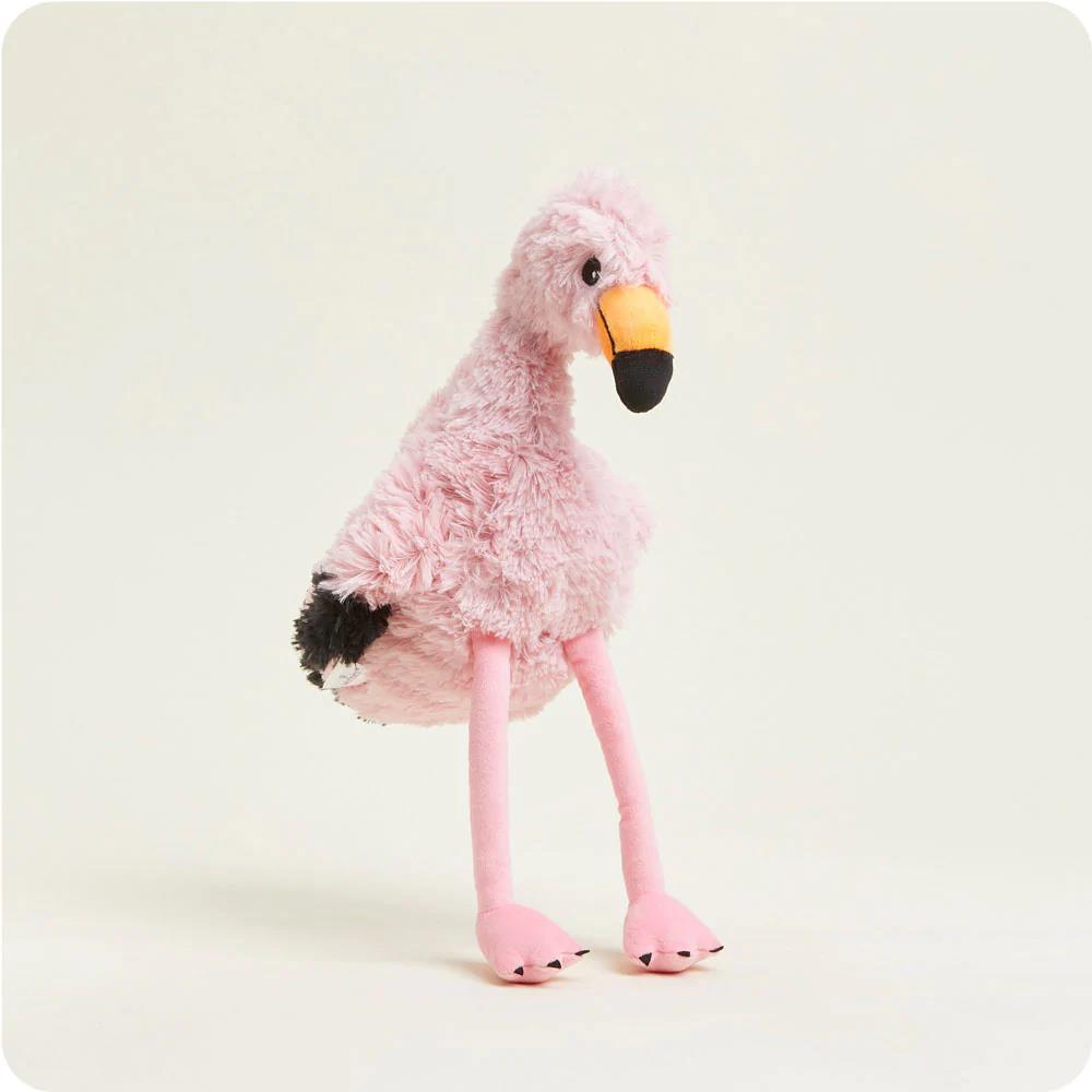 Plush pink flamingo toy with soft fur and long legs.