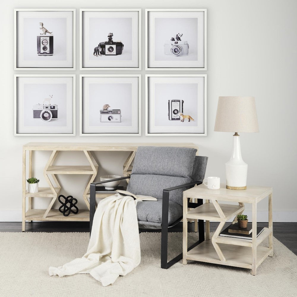 Cozy lounge area with modern decor and vintage camera art.