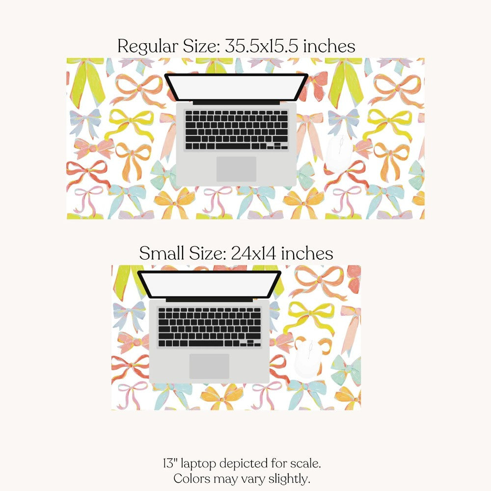Two mousepad sizes with colorful bow patterns behind laptops.