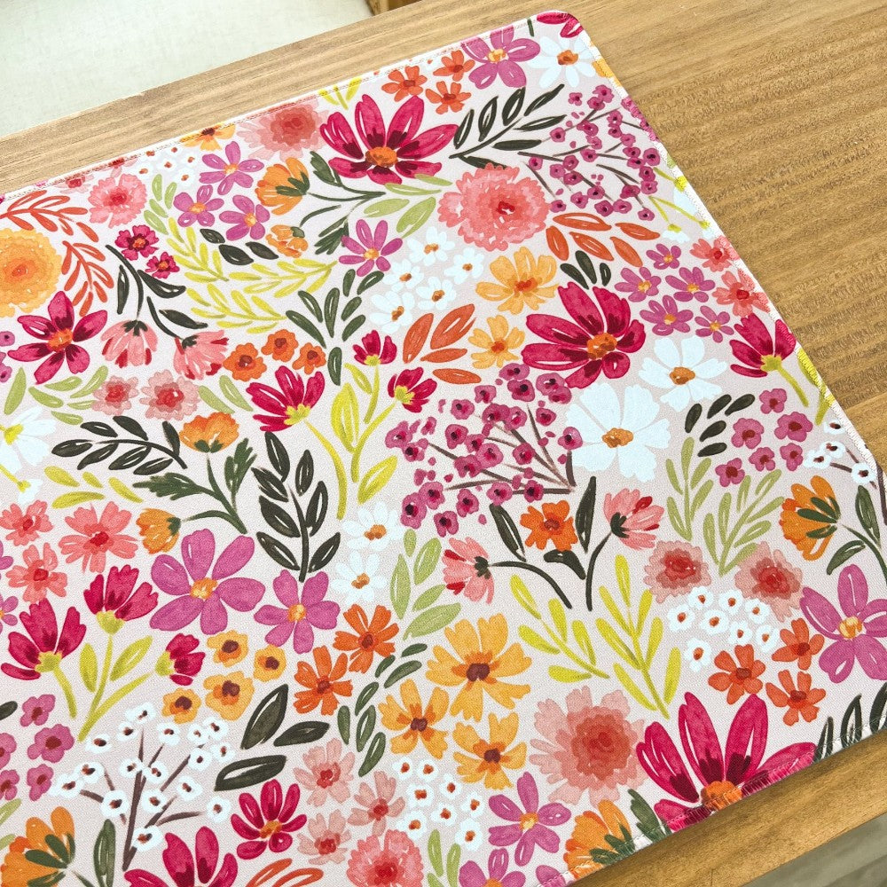 Colorful floral pattern on a wooden surface.