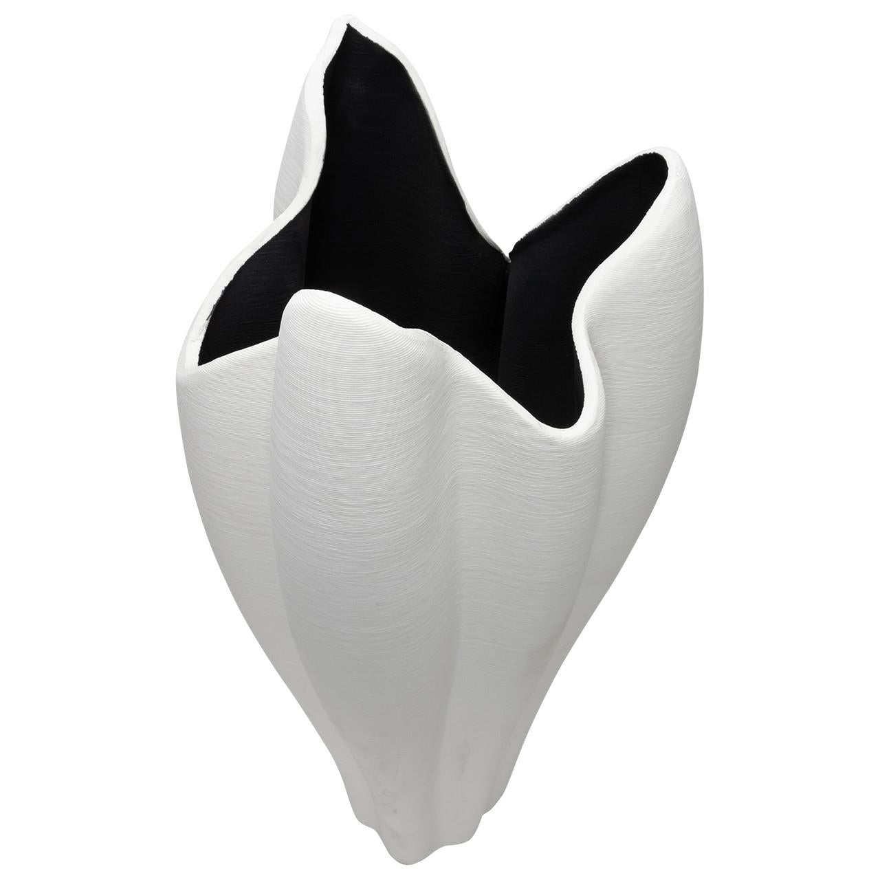 Abstract, white, sculptural vase with black interior.