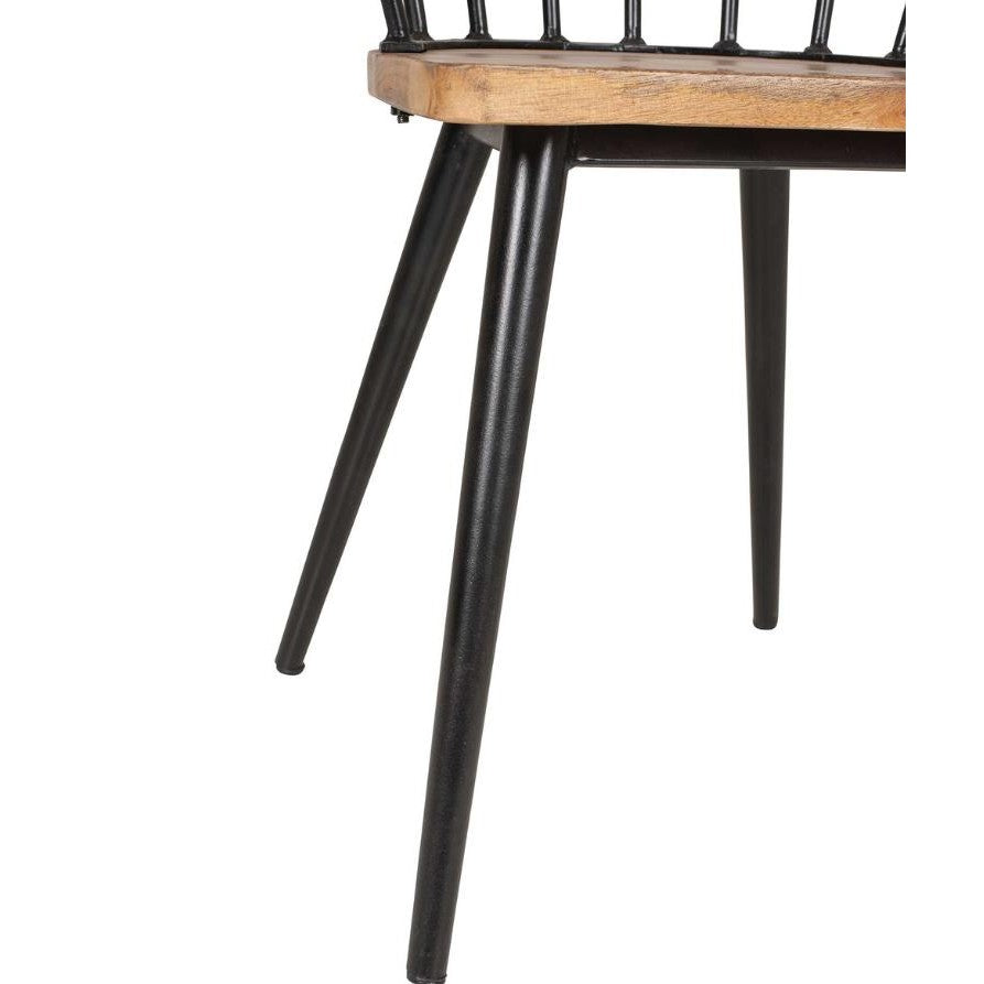 Chair with black metal legs and wooden seat.
