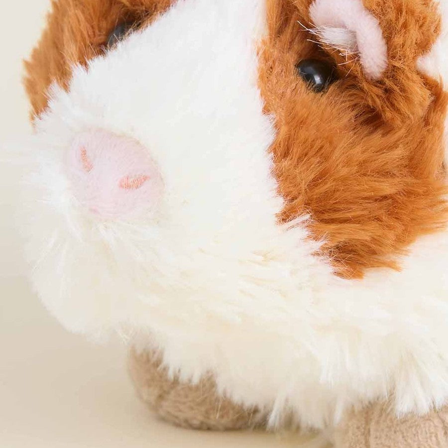 Fluffy guinea pig plush with brown and white fur.