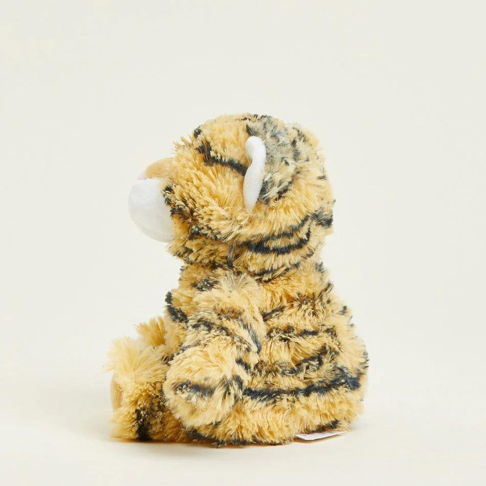 Fluffy tiger plush toy sitting side view.