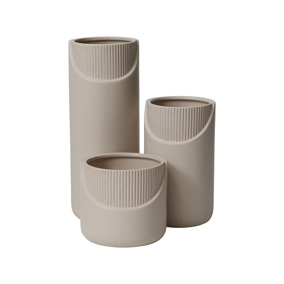 Three beige, textured cylindrical vases of varying heights.