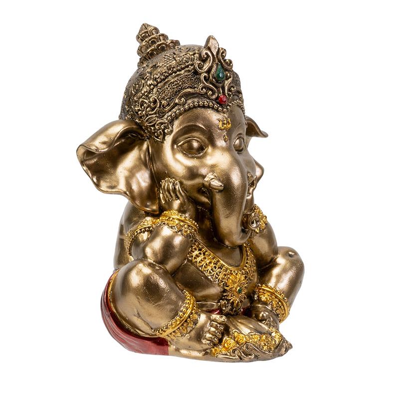 Golden Ganesha statue with ornate details and seated posture.
