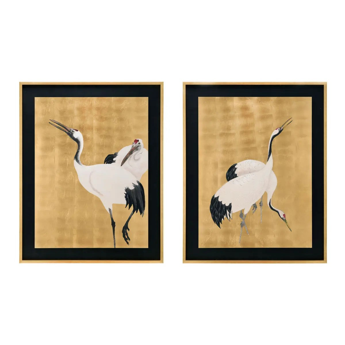 Two framed paintings of elegant cranes on a golden background.