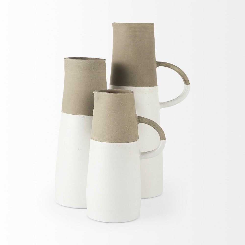 Three tall stoneware jugs, two-toned in brown and white, with handles.