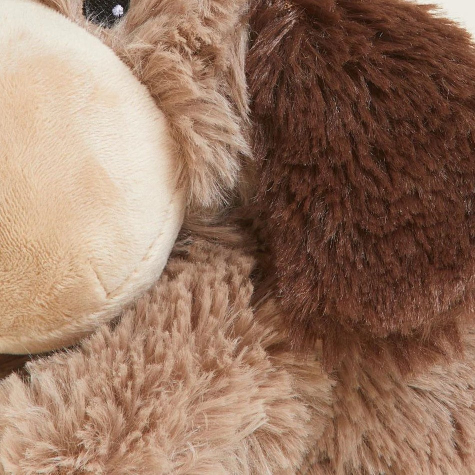 Close-up of a fluffy brown stuffed animal with big ears.