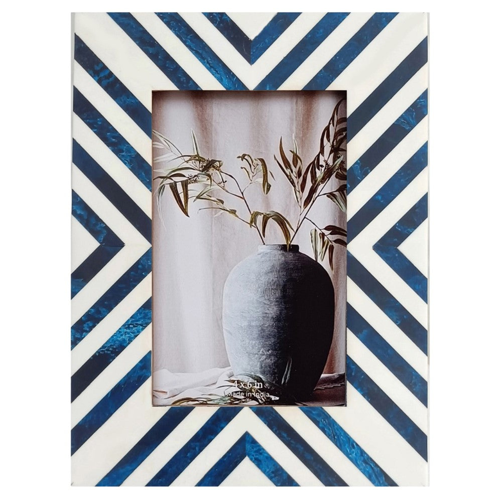 Striped frame with vase and plant in the center.