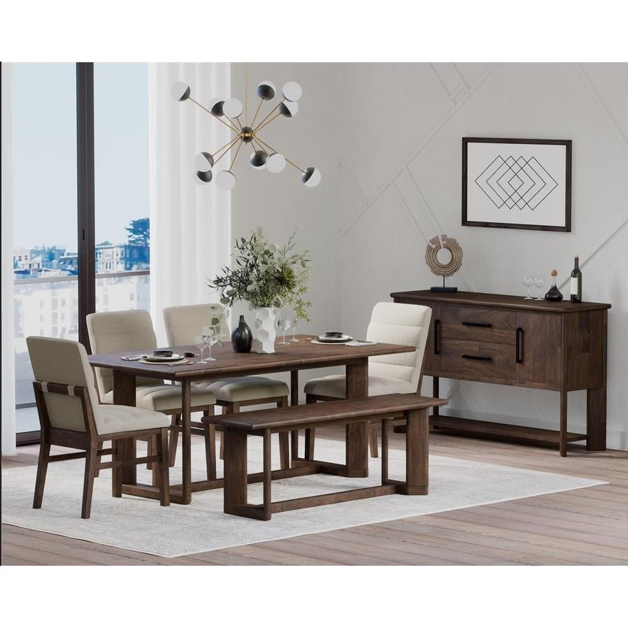 Modern dining area with wooden furniture and geometric decor.