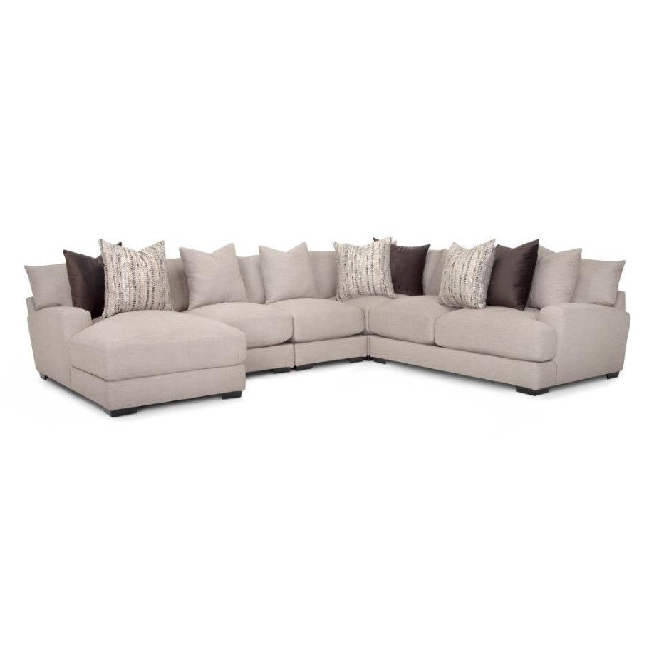 Beige sectional sofa with assorted pillows.