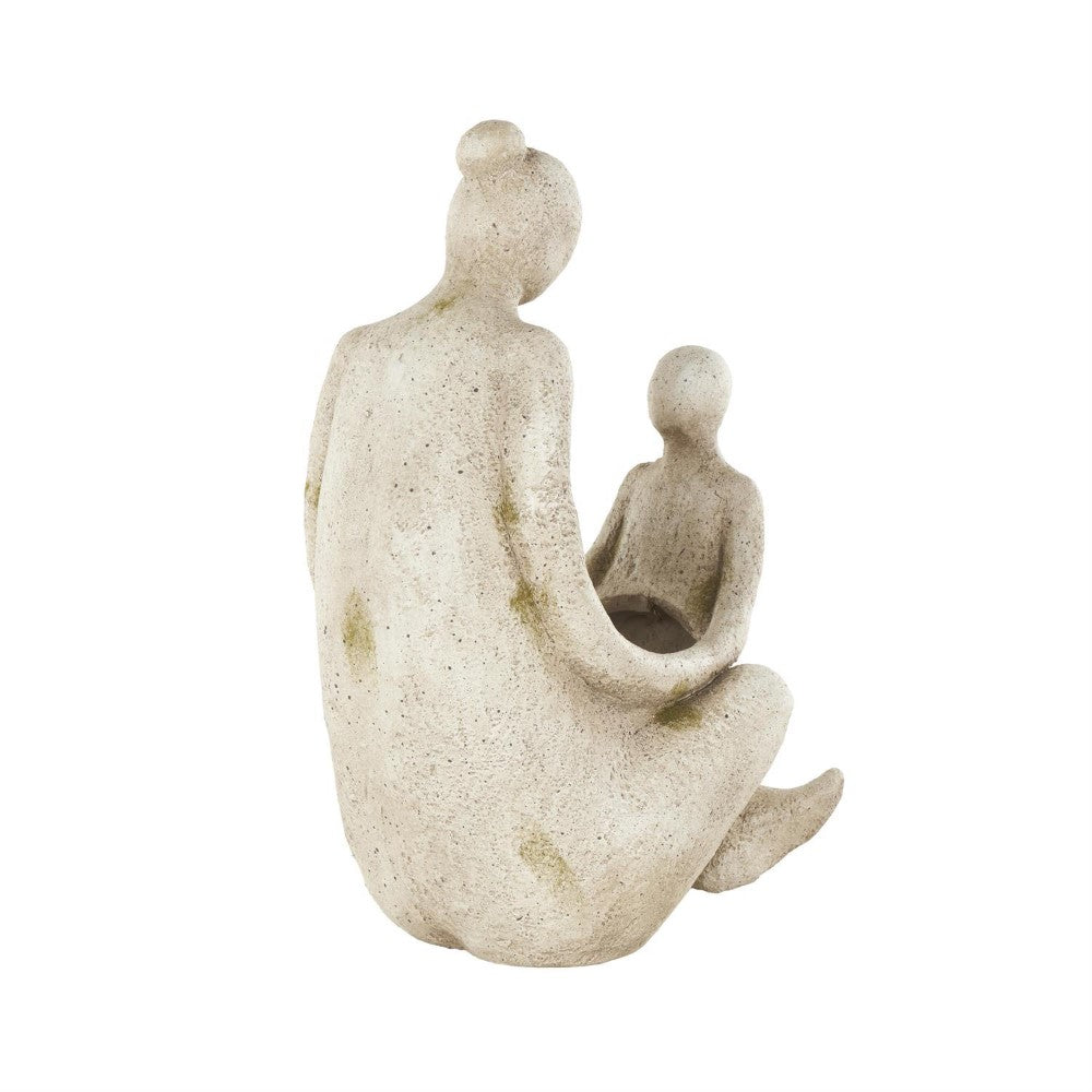Abstract sculpture of a seated person holding a child.