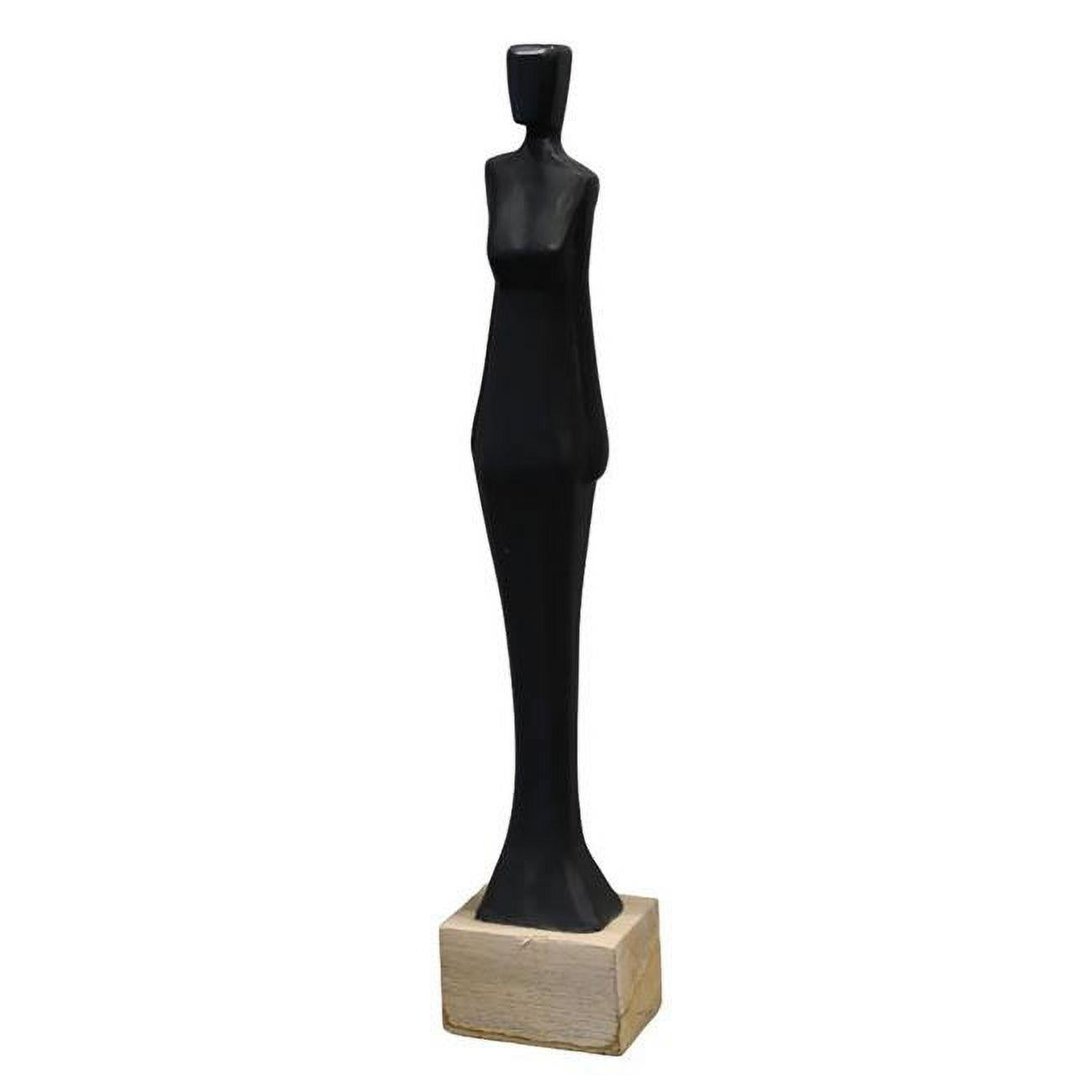 Abstract black figurine on a wooden base.