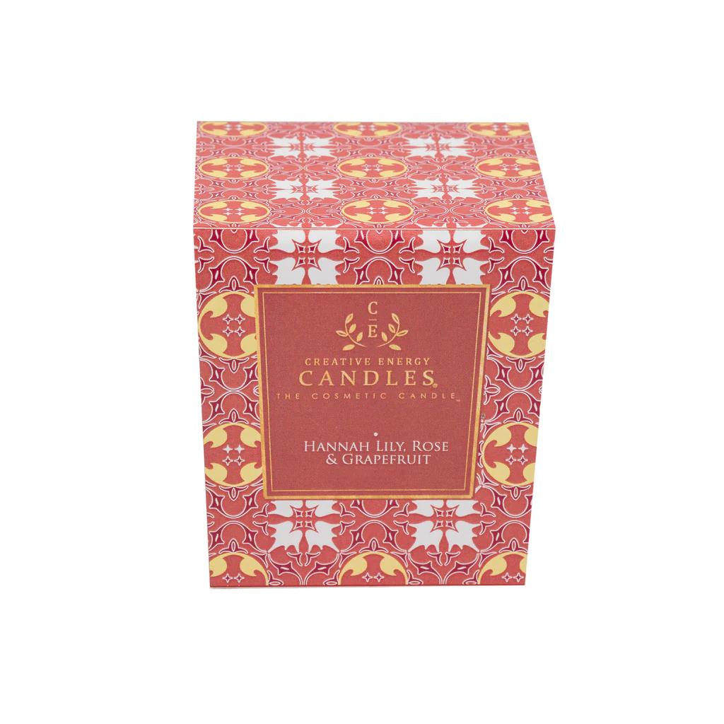 Ornate candle box with pink and gold patterns, labeled "Creative Energy Candles."