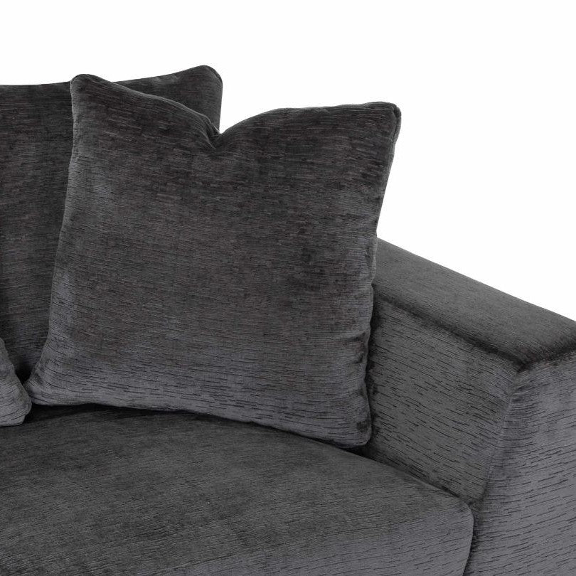 Dark gray sofa with textured fabric and plush cushions.