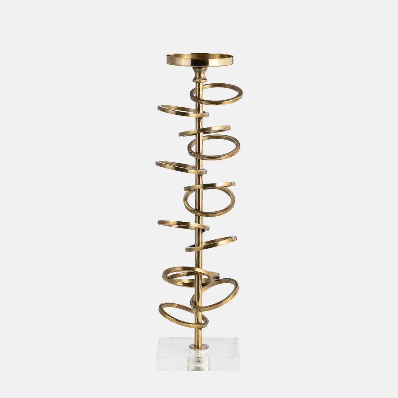 Gold spiral candle holder with a clear base.
