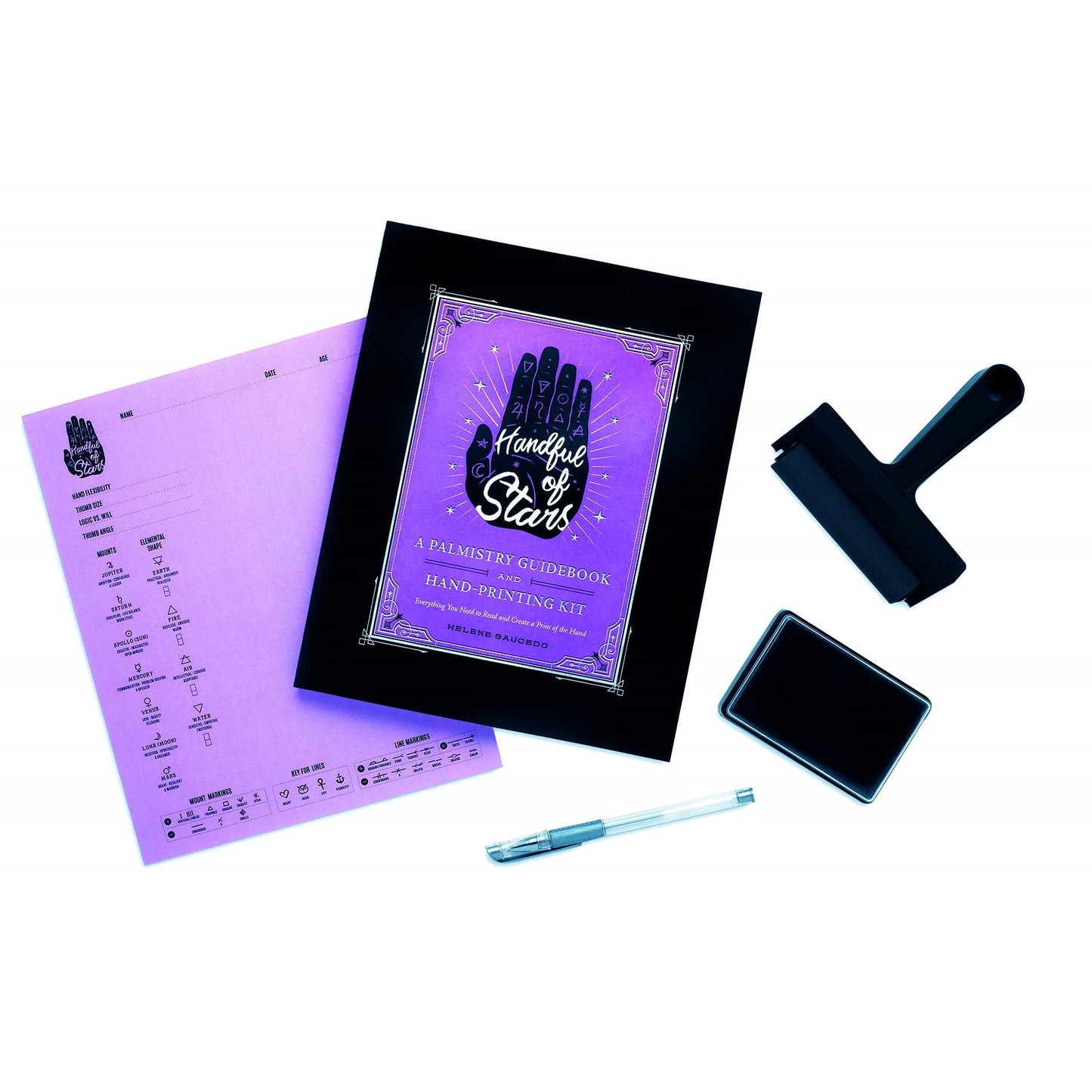 Palmistry guidebook and hand-printing kit with tools on white background.