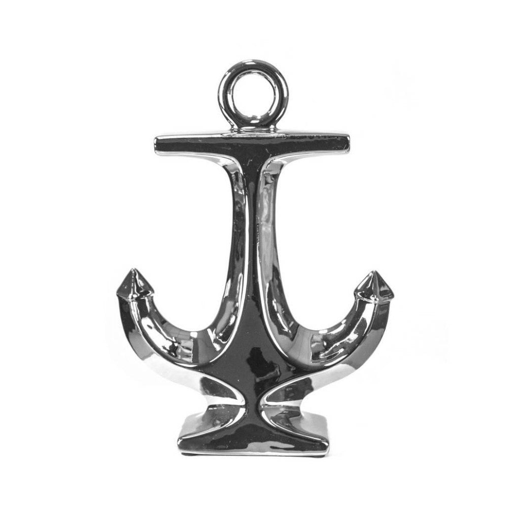 Shiny chrome anchor sculpture on a white background.