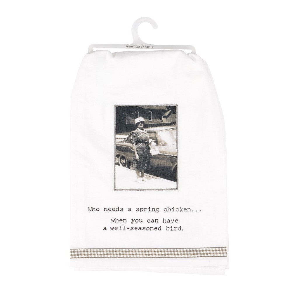Vintage-style towel with humorous text and photo of a woman by a car.