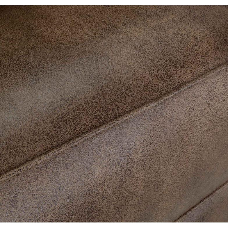 Close-up of a textured brown leather surface.