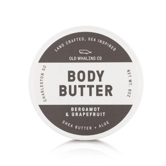 Round container of body butter with bergamot and grapefruit scent.