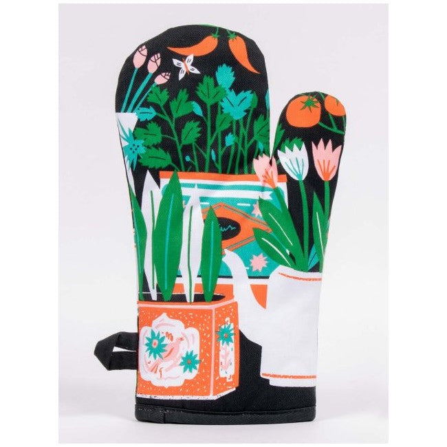 Colorful oven mitt with plant and vegetable illustrations.