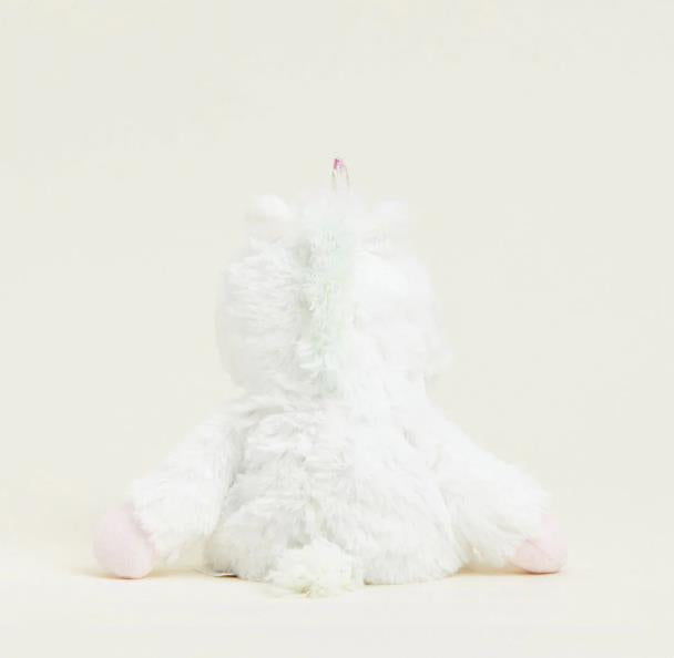 Fluffy white unicorn toy viewed from behind.