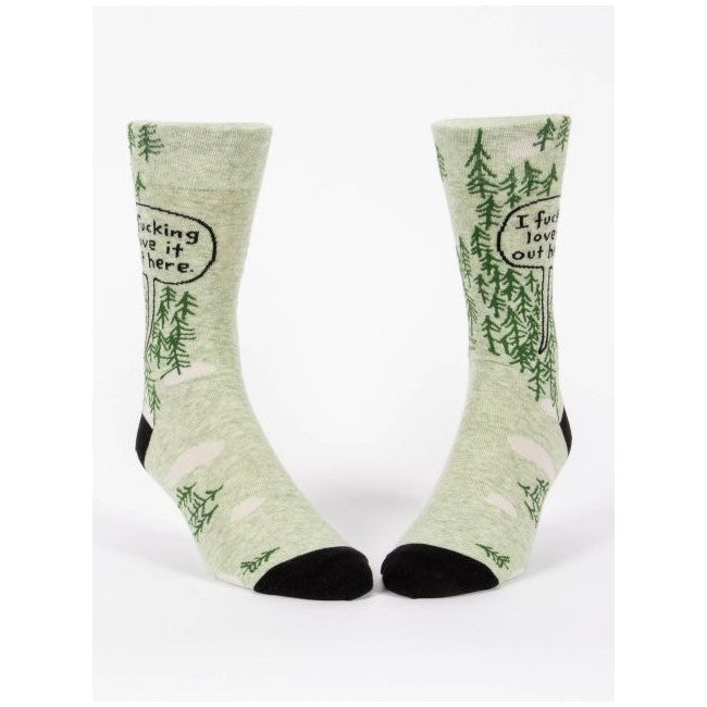 Green socks with woodland designs and humorous text.