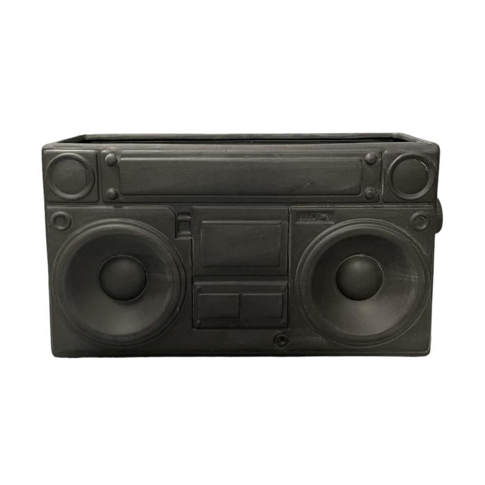 A black, retro-style boombox planter.